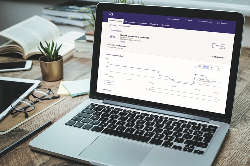 Online banking interface showing account details on a laptop.