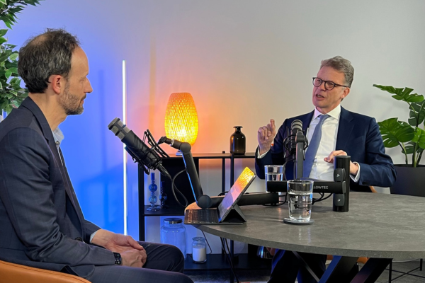 Christian-Sewing-Michael-Steen-at-a-table-with-microphone