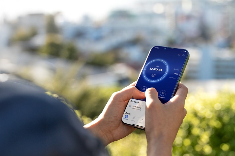 A person checks their bank balance on a mobile banking app. Photo © Getty Images and Deutsche Bank.